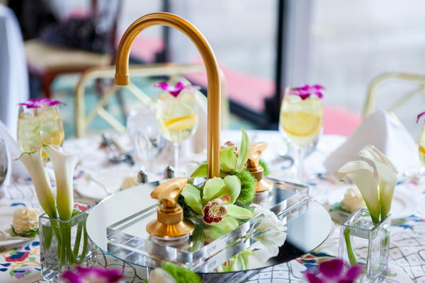 Table centerpieces featured custom linens from Mally Skok Design paired with various Rohl faucets.