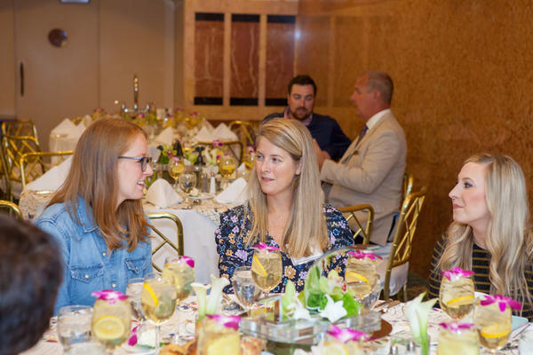 Guest panelist Annsley McAleer (center) talks with guests during the luncheon at the Rohl Auth Lux Summit in Boston.