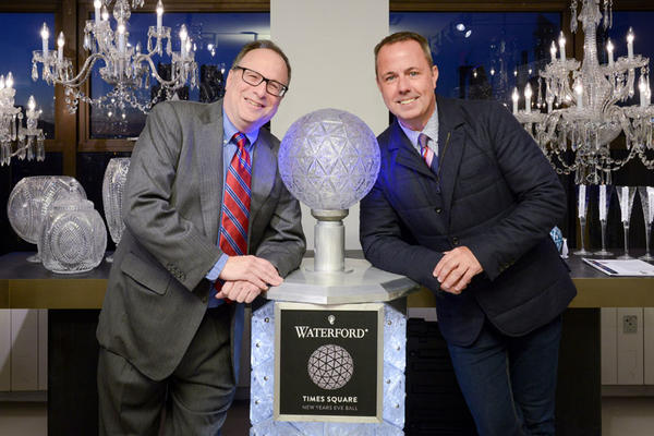 Jeffrey Straus and Michael Craig pose with the Waterford Times Square Crystal Ball podium.