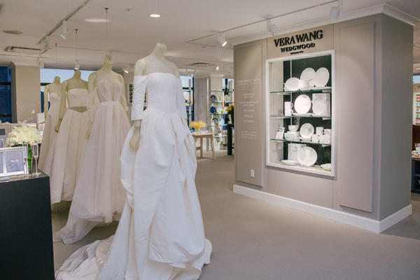 Vera Wang wedding dresses on display near her new Perfect White dinnerware collection for Wedgwood.