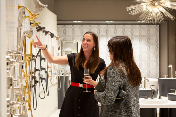 Guests, including Sarah Fitzsimmons (left), had a chance to interact with the Kohler product.