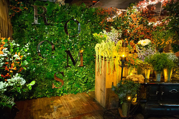 The restaurant was festooned with a greenery wall.