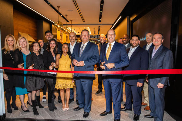 The Dacor executive team, with members of the Mart team, cut the ribbon to the new Dacor Kitchen Theater Chicago.