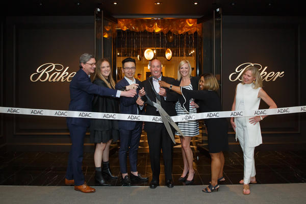 The ribbon cutting at Baker’s grand-opening party with the Baker team, Katie Miner and Kim Johnson