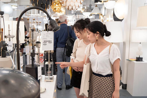 Guests browse new products from Circa Lighting on display during What’s New What’s Next.