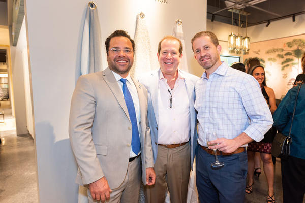 Scott Kravet (center), with City of Hollywood mayor Josh Levy and economic development manager Herbert Conde-Parlato