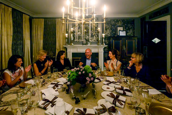 Guests sit for an intimate dinner. 