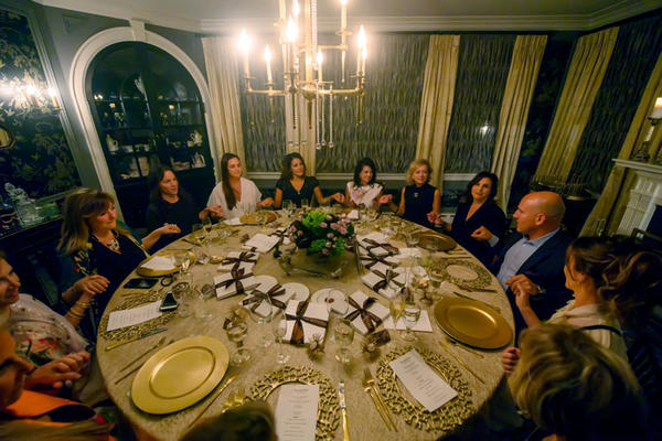 Guests sit for an intimate dinner. 