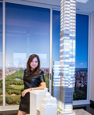 Lauren Rottet with a larger-scale model of the 131-story tower 