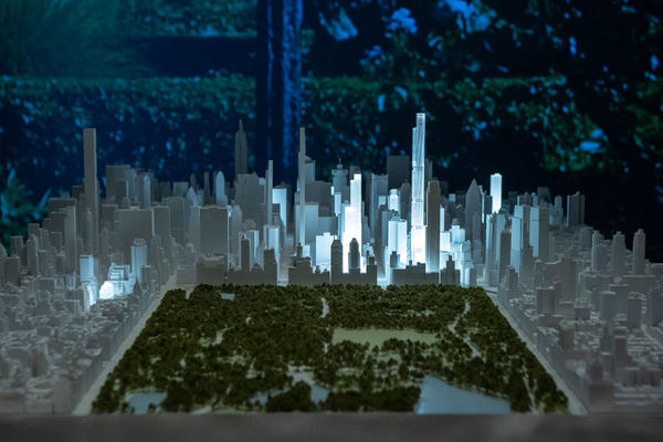 Extell buildings light up a model of the cityscape.