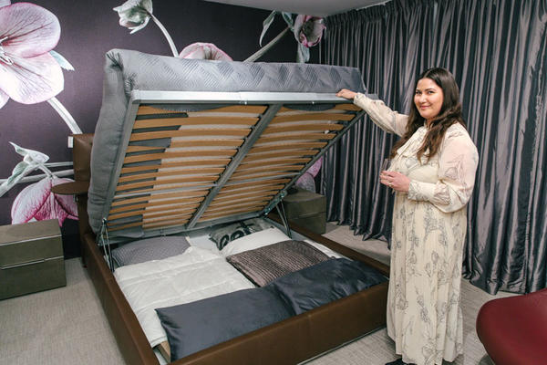 Emily Ingram shows off the Chagall storage bed.