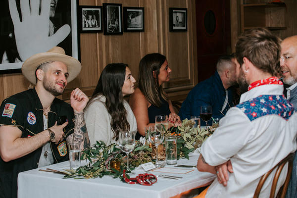 Nico Tortorella and other guests enjoying conversation during Elle Decor’s March issue celebration