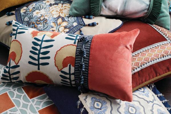 Pillows (top to bottom): Bohemian Velvet in Atlantis with Chondo trim in Teal Frost and Azizi trim in Canvas; Bohemian Velvet in Amber Gold with Mala trim in Saffron; Bohemian Velvet in Loden Frost and Shibori fabric in Loden Frost with Tenango trim in Jungle; Bohemian Velvet in Angora and Peafowl fabric in Ink with Lintong trim in Ink; Bohemian Velvet in Punch with Chondo trim in Pottery Mix; Bohemian Velvet in Burnt Sienna and Hopps Floral fabric in Pottery with Chai trim in Ink; Bohemian Velvet in Ink and Ancoats fabric in Denim with Belle trim in Pristine; Bohemian Velvet in Coral Clay  with Ikata trim inLoden Frost