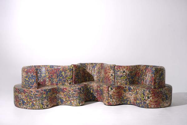 Floribunda leather in Multi covers a sofa