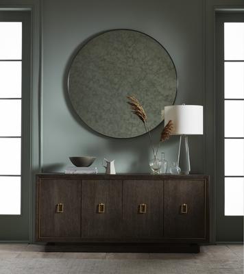The Astor Round Mirror over the Emmerson Buffet