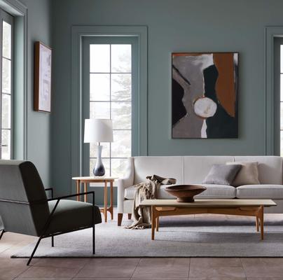 The Yves Chair, paired with the Cara Sofa and Laguna Tables
