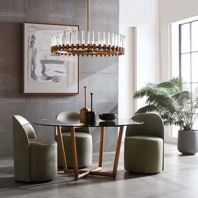 Margaux Dining Chairs surround a Modern Round Dining Table