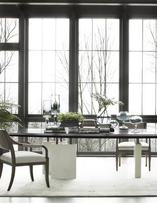 Saber Leg Dining Chairs surround a Block Dining Table
