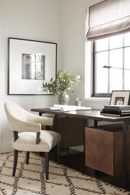 A Spoonback Dining Chair sits in front of the Barstock Desk
