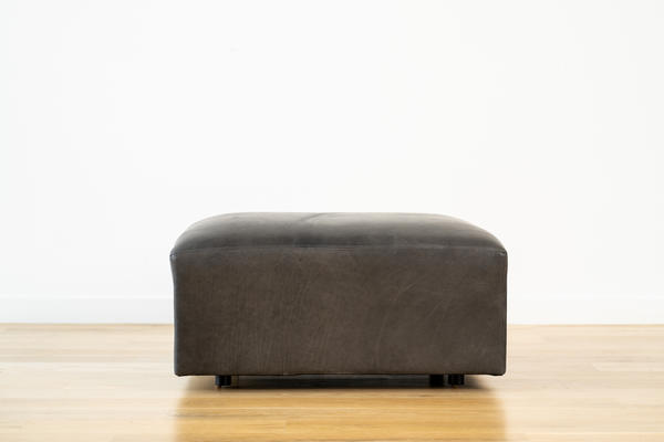 Linden Ottoman in Charcoal leather