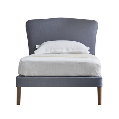 The new Christo single bed features a striking peaked curved headboard.