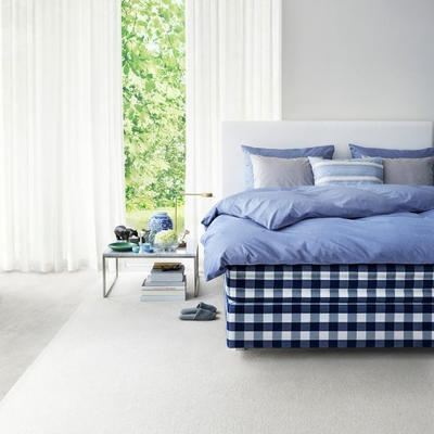 Hästens Herlewing Bed, with a Duvet Cover in Shady Blue and
Cases in Archipelago Breeze and Silver Grey