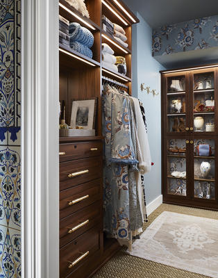 Laren Walk-In Closet in Chestnut with LED lighting and glass doors 

Design by Michelle Nussbaumer; photography by Lisa Petrole