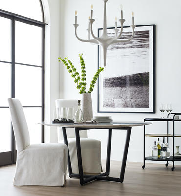  Julia slipcovered chair, Modern Round dining table, and Flora chandelier