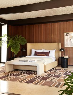 Anni rug by Nina Freudenberger, styled with the Valen platform bed in Wheat, Tate bench in Cream, andLuna side table in Black