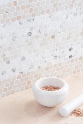 Penny Lane is a take on penny-round mosaics, elevated in an artistic fashion through the use of luxe natural stone and presented in a true penny size, in an offset pattern. 