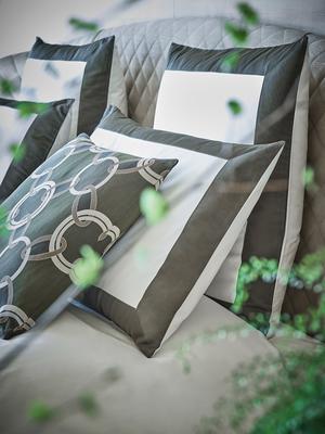 Bold sheet set and euro pillowcases in Milk-Aloe styled with Luxury Chains decorative pillow in Aloe-Savage Beige.