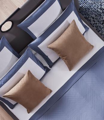 Herringbone duvet cover in Dark Azure styled with Bold sheet set and euro pillows in Milk-Dark Azure as well as Luxury Suede decorative pillows in Camel.