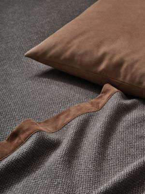 Tuileries throw in Beige-Aloe with Luxury Suede decorative pillow in Camel.