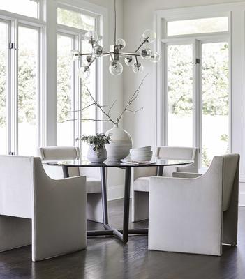 The Modern Round Table with the Edie Chair in performance velvet