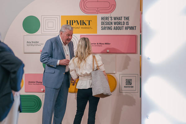 The Design World’s Destination by High Point Market included an interactive map and a feature wall of designer testimonials. Pictured here in the space is Tom Conley, CEO of the High Point Market Authority.