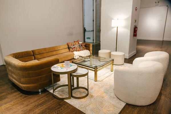 Additional lounge seating was provided in the main lounge, featuring items from Flor, Currey & Company and Annie Selke.