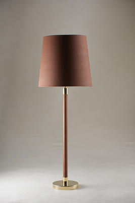 The Huxley family follows the success of the Holden collection of cane wrapped lamps. The leather used on the Huxley is produced using plant-based materials and environmentally conscious techniques. The Huxley comes in either Tan Leather of Chocolate Leather with a Brass or Antiqued Brass base. 