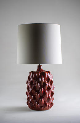 The vibrant and fiery Red Magma finish is new to the Baobab lamp, and perfectly complements the natural palette of decorative and lustrous glazes. Inspired by the form and texture of a Bajan seed pod, each Baobab takes on a life of its own. The alchemy of firing ensures that no two Baobabs will ever be identical. 