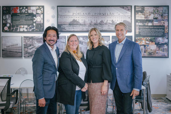 Creative Tops partner Milton Tjin (left), vice president Paul Pogor (right) and chief development officer Lisa Knierim (second from left), pictured with Kristi Forbes of 41 Madison (second from right), traveled to debut their new showroom in-person on the 18th floor.