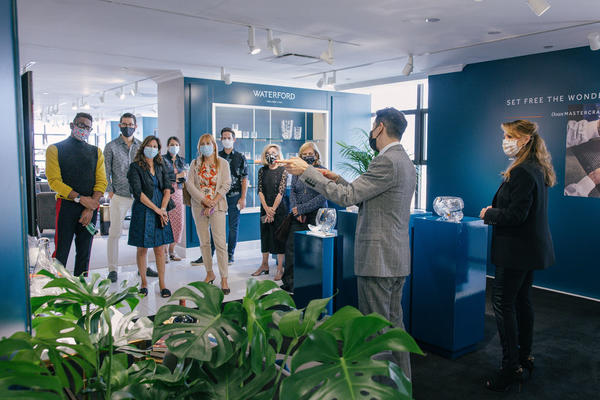 Fiskars group retail marketing manager Douglas Yuen and director of public relations and special events Michelle Westcott-Richards tours a group through the Waterford Lismore collection on Designer Day.