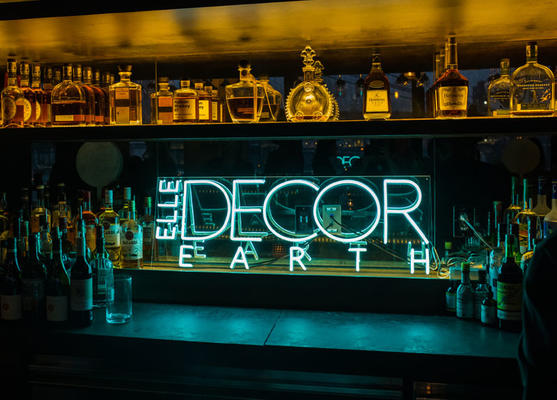Bright neon lights, big city: A custom Elle Decor neon sign adorned the bar at Harriet’s Lounge in 1 Hotel Brooklyn Bridge.
