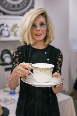 Cindy Lewis, VP of Galerie, holds a recently reintroduced Haviland XL coffee cup, originally designed for President Abraham Lincoln.