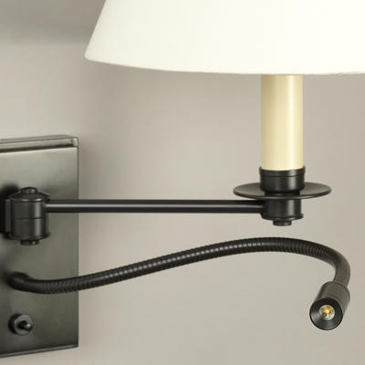 Pared down and minimalist in style, this wall light elegantly combines a single swing arm with the practicality of a flexible reading light.