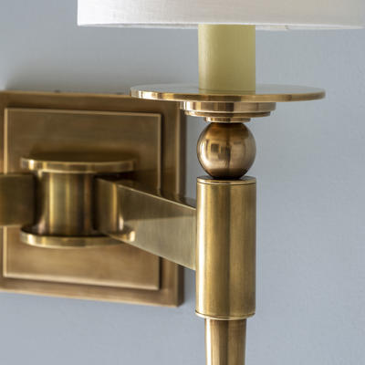 The Candover Wall Light detail - Precisely engineered using solid brass components combined with frosted opaline glass shades. The unlacquered antique brass finish matures beautifully with age.

Available with frosted glass or linen shades.