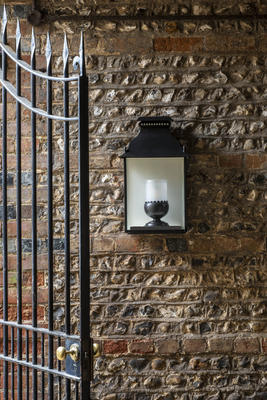 Denmead Wall Lantern - Large in scale, this wall light was inspired by an 18th century French design. Combined together, the graceful domed top and scalloped funnel holder with decorative fretwork and finials add definition and elegance. Suitable for exterior use and UL listed wet location 