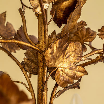 The Windermere Chandelier has a soldered and hand fabricated steel frame with pressed steel leaves which are decorated in a hand painted gilt finish. The leaves are individually soldered in place.