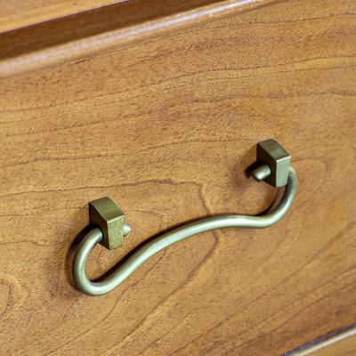 Colemore Chest of Drawers detail - Antiqued brass handles beautifully compliment the subtle cherrywood finish. 
