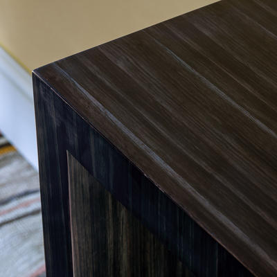 Ripley Console Table detail - Made from amara veneer which is stained to a charcoal finish which enhances its wonderfully distinctive graining.
