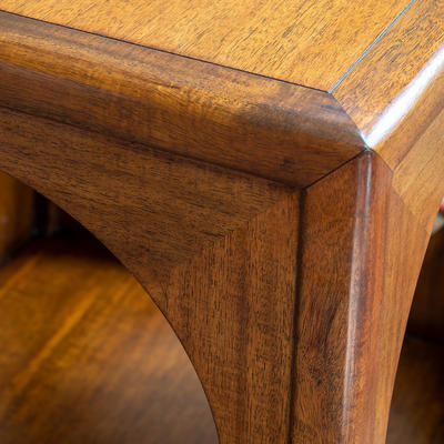Somborne Table detail - This distinctive side table is made from a combination of solid acacia and acacia veneer. It stands on a black lacquered base, making for a more modern aesthetic. 