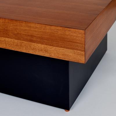 The Woodcott Table detail - Produced from a distinctive combination of acacia veneer with a deep, black lacquered base.
